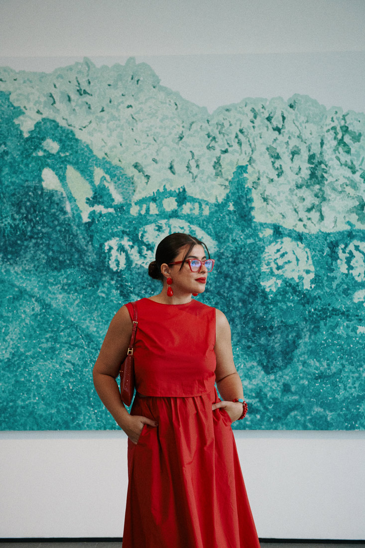 Mina Al Sheikhly in front f a painting inside the He Museum in Shunde