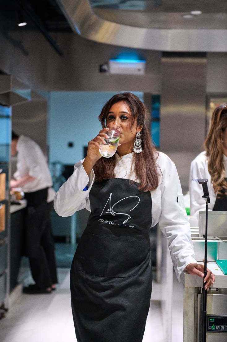 Mariyam Kisat takes a break while making dumplings under the supervision of a local chinese chef