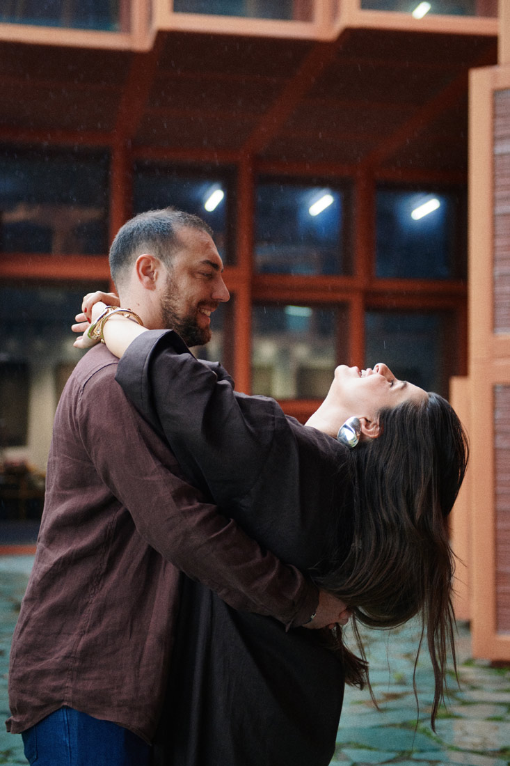 Mina Al Sheikhly and Nelson Barrios dance under the monsoon rains in Lunjiao, Shunde