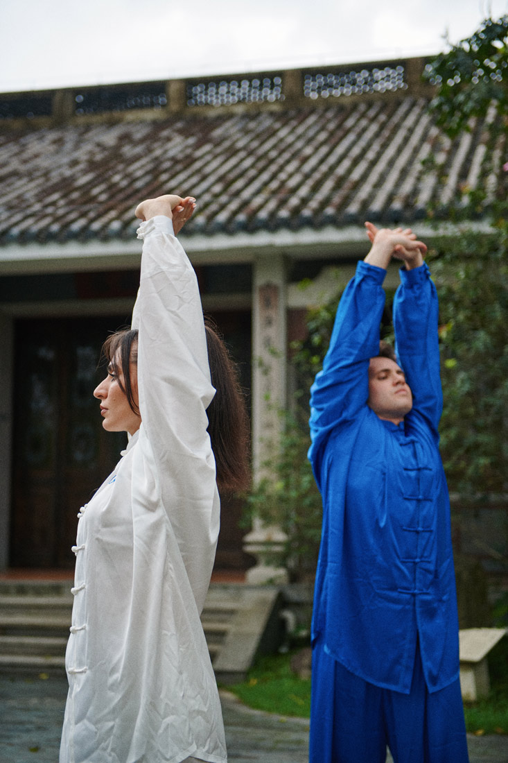 Soleen Mohammed & Riaan Barnard stretch before their outdoors Taichi session.