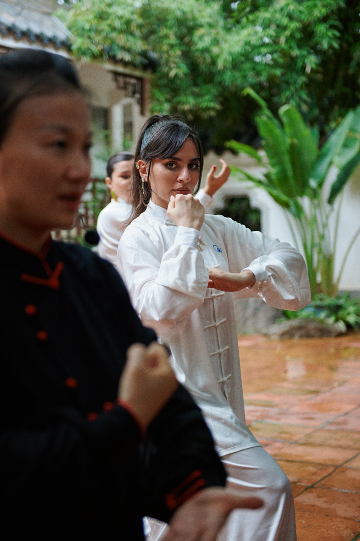 Soleen Mohammed moves following their local taichi instructor