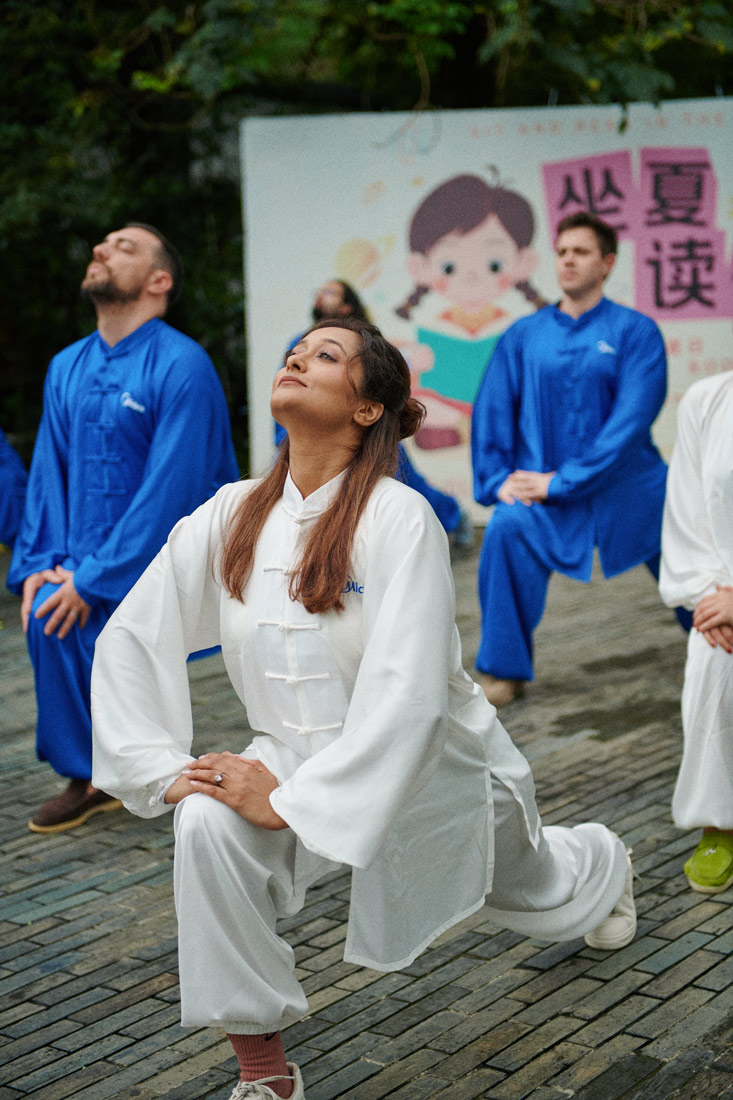 Mariyam Kisat practices her Taichi moves under the supervision of a Taichi master