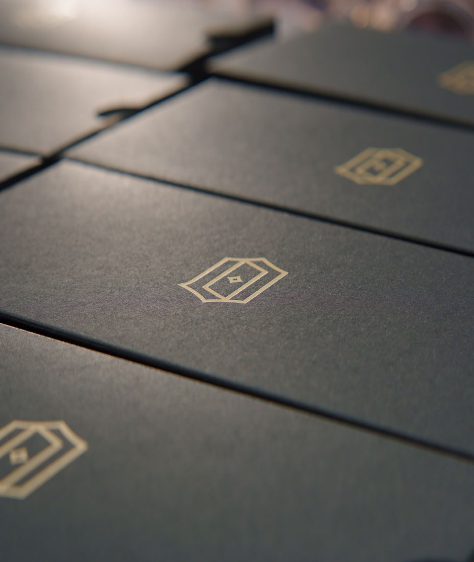 Cinematic shot of the quality control and inspection of the package for James Oro glasses in a factory inspection.