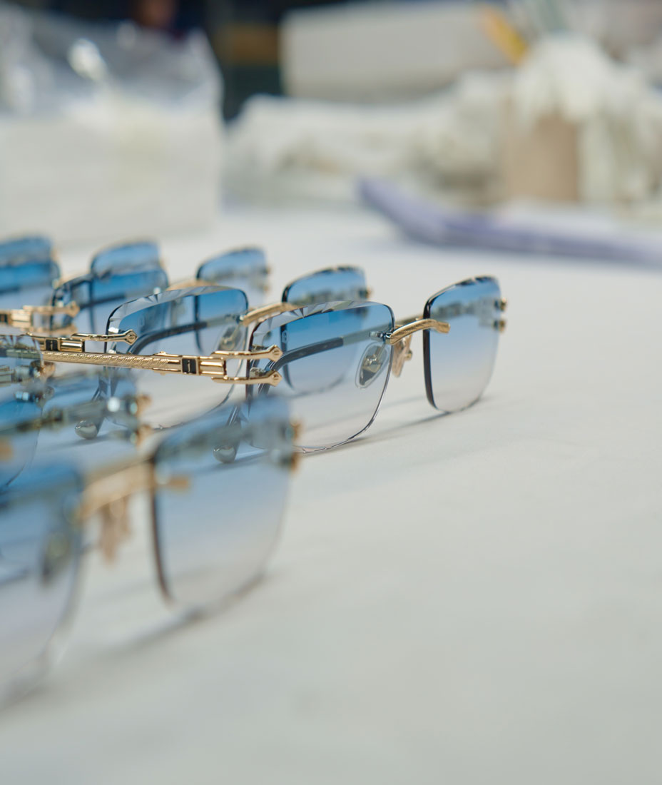 Cinematic close up of the QC for James Oro titanium glasses in the factory.