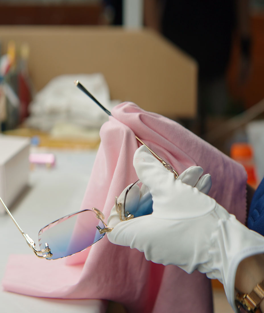 Cinematic close up of the QC for James Oro titanium glasses in the factory.
